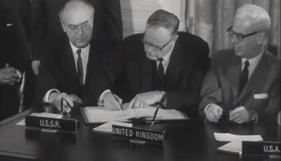 The USA, UK and Soviet Union sit side by side as they sign The Outer Space Treat. (Credit: British Pathé)